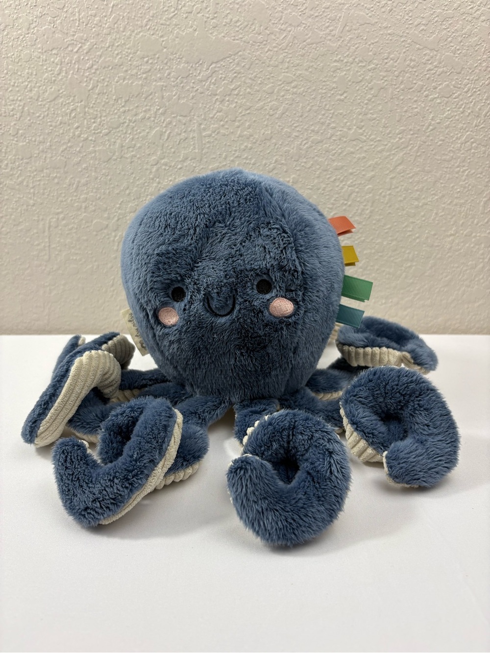 Itzy Ritzy Sweetie Snuggles Plush Toy Named Ollie the Octopus.